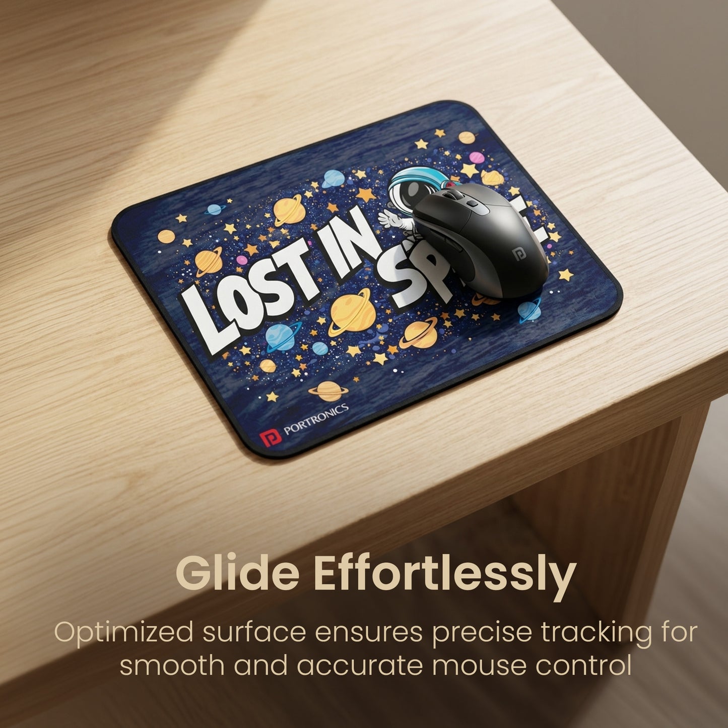 portronics comfipad space printed mouse pad with wireless mouse placed on wooden desk showing smooth fabric surface for precise tracking and effortless mouse control | ideal mousepad for pc laptop and computer for work gaming and designing | best computer accessories and mousepad for mouse available online